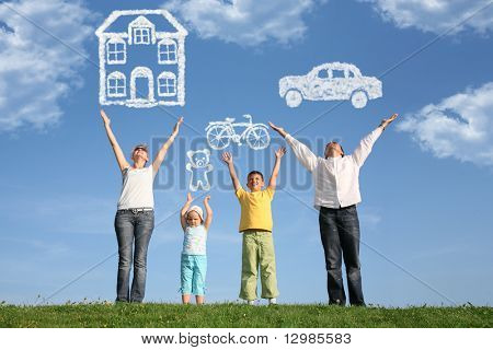 Picture or Photo of Family of four on grass with hands up and dream