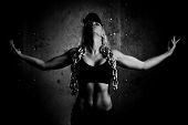 picture of sports  - Young sports woman with heavy chain - JPG 