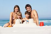 stock photo of holidays  - Family Building Sandcastles On Beach Holiday - JPG 