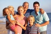 picture of beach  - Portrait Of Three Generation Family On Beach Holiday - JPG 
