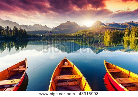 Picture or Photo of Mountain lake in National Park High Tatra. Dramatic overcrast sky. Strbske pleso, Slovakia, Europe. Beauty world.