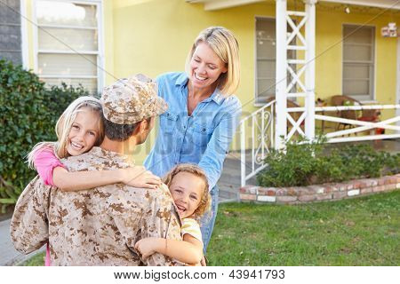 Picture or Photo of Family Welcoming Husband Home On Army Leave