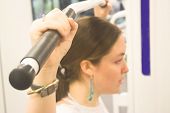 pic of pulldown  - beautiful woman puling weights  - JPG 