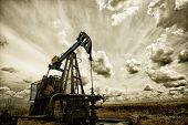 picture of sunset  - Oil pump industrial machine for petroleum in the sunset background - JPG 