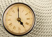 picture of tick tock  - Clock with Roman numerals on cord background - JPG 