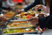 foto of food  - people group catering buffet food indoor in luxury restaurant with meat colorful fruits  and vegetables - JPG 