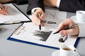 picture of meeting  - Image of business people hands working with documents at meeting - JPG 