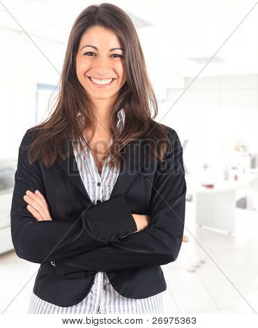 Picture or Photo of Portrait of a cute young business woman smiling, in an office environment