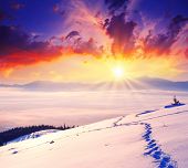 foto of sunset  - majestic sunset in the winter mountains landscape - JPG 