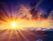 image of sunset  - Majestic sunset in the winter mountains landscape - JPG 