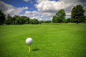 picture of golf  - Golf ball on tee in a beautiful golf club - JPG 