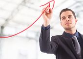 pic of future  - Businessman drawing a rising arrow - JPG 