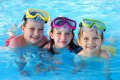 image of kid  - Happy kids playing and having fun together in the pool - JPG 