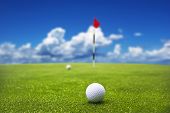 picture of golf  - Golf ball on the green  ready to be putt into the hole - JPG 