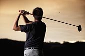 stock photo of golf  - Close up of male golf player in black shirt teeing - JPG 