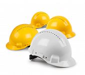 stock photo of team  - Four hard hat work team protective safety helmets isolated - JPG 