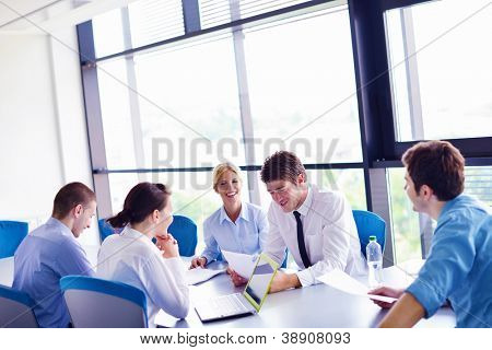 Picture or Photo of Group of happy young  business people in a meeting at office