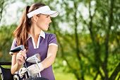 foto of golf  - Gorgeous golfer lady with golf equipment - JPG 