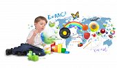 stock photo of science  - A young boy is sitting on a white isolated background blowing bubbles of science - JPG 