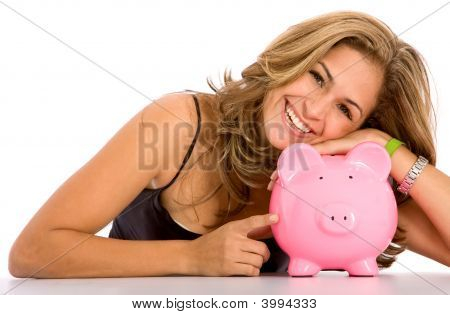 Picture or Photo of Casual woman looking to save money in a piggy bank