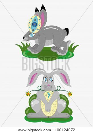 Two easter rabbits sit against a grass