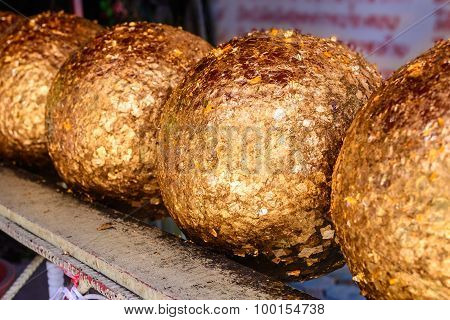 Loknimit, Round Stone Cover Thinly With Gold.
