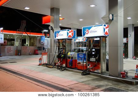 HONG KONG - APRIL 15, 2015: Caltex fuel station at evening. Caltex is a petroleum brand name of Chevron Corporation used in more than 60 countries