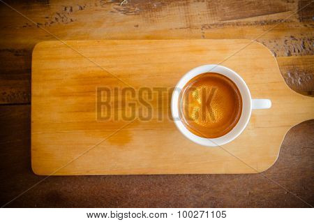 Cup Of Coffee On Wooden Table