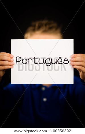 Child Holding Sign With Portuguese Word Portugues - Portuguese In English