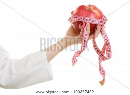 Doctor Specialist Holding Fruit Apple And Measure Tape