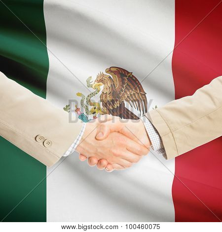 Businessmen Handshake With Flag On Background - Mexico