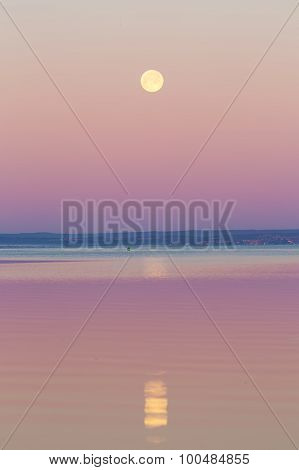 Moon Setting Over Sea.