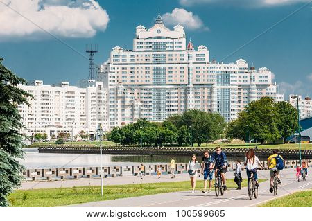 People walking along the the riverside promenade in district Nem