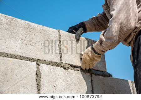 Worker Make Concrete Wall By Cement Block And Plaster At Construction Site ,worker Hand Wearing Glov