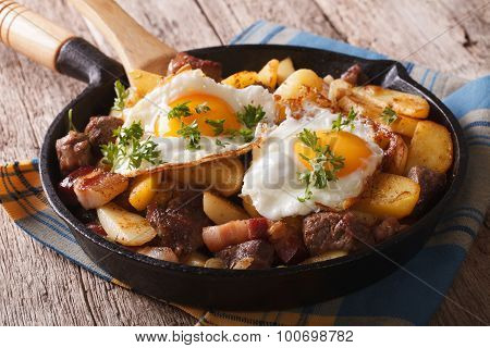 Tyrolean Fried Potatoes With Meat, Bacon And Eggs In A Pan. Horizontal