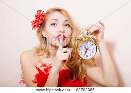 Blonde woman with alarm-clock