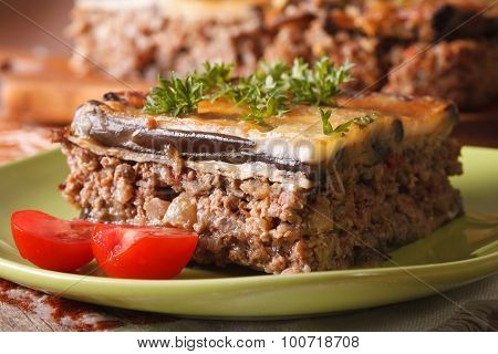 Piece Of Moussaka With Tomatoes On A Plate Macro. Horizontal