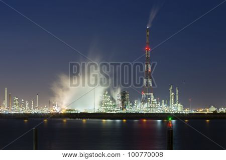 Flare Stack And Harbor Industry At Night