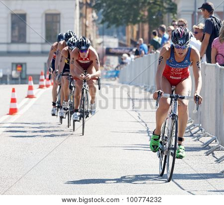 Triathlete Carolina Routier Cycling, Followed By Competitors