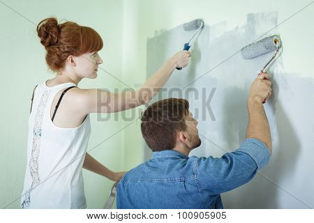 Couple Painting Wall Together