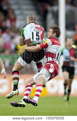 TWICKENHAM, ENGLAND. 17 SEPTEMBER 2011. Harlequins Mike Brown, is tackled illegally in the air by Gloucester's Henry Trinder, during the premiership rugby union match between Harlequins and Gloucester