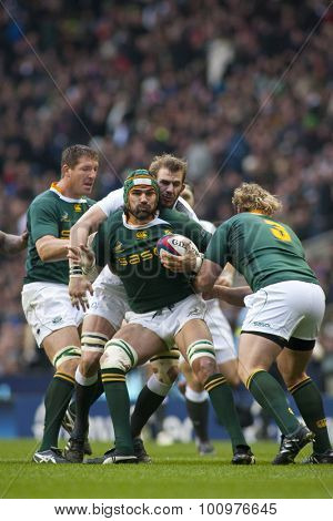 TWICKENHAM LONDON, 27 NOVEMBER 2010.  South Africa's Victor Matfield , is tackled by England's Tom Croft, as South Africa's Jannie du Plessis, approaches during the Investec International match 