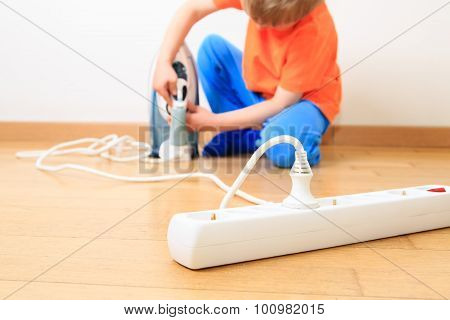 child playing with electricity, kids safety