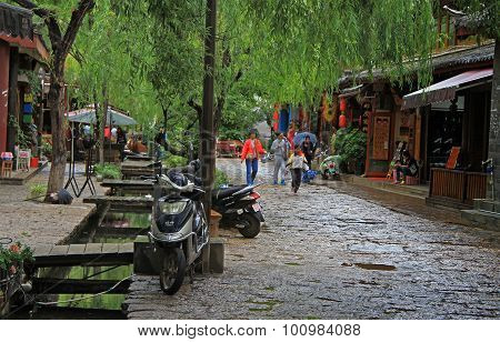 people are walking on the street in Lijiang, China