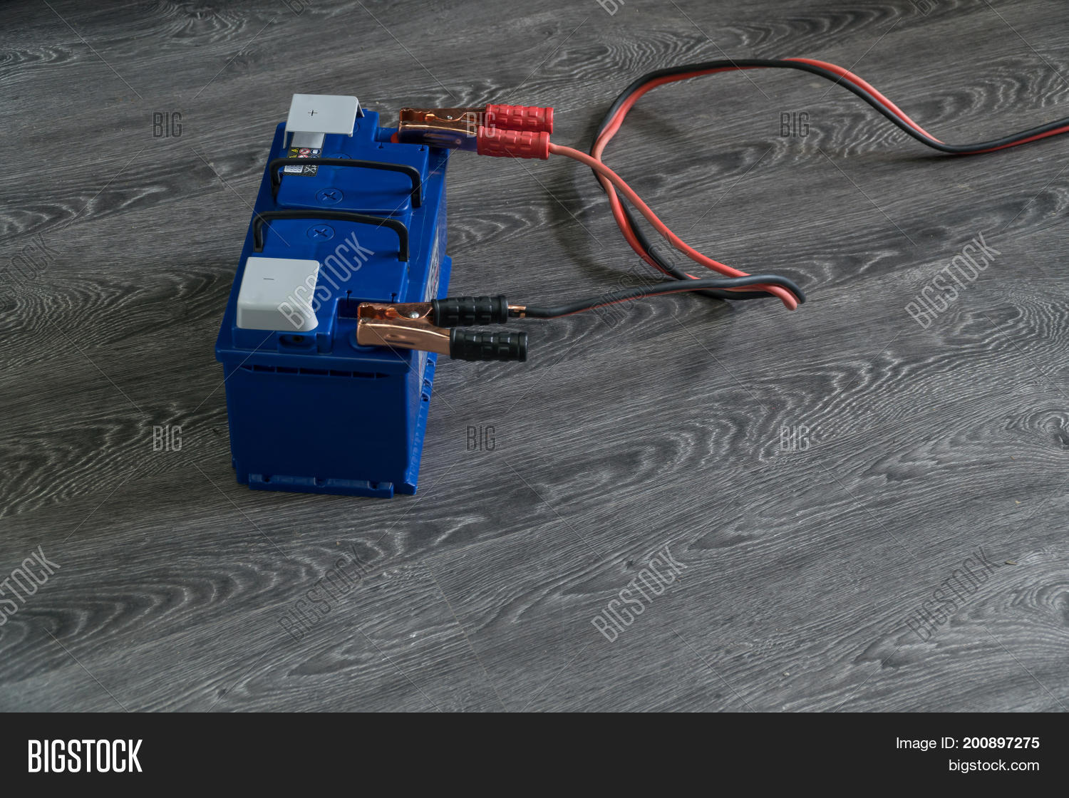 Recharging Car Battery Image Photo Free Trial Stock Recharging The Car Battery On A Wooden Background