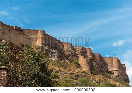 Wide angle picture of Mehrangarh Fort on the top of the city of Jodhpur the blue city of Rajasthan in India.