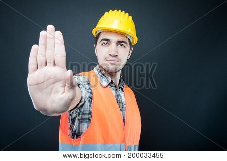 Constructor Wearing Equipment Showing Stop Gesture