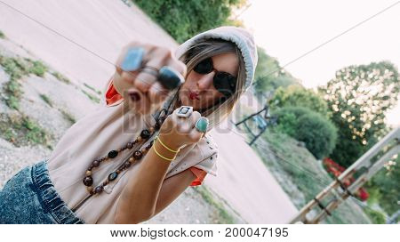 Girl power concept. Young girl making facial expression and punch