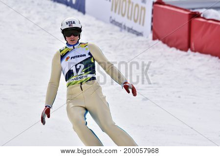 Rasnov, Romania - February 7: Unknown Ski Jumper Competes In The Fis Ski Jumping World Cup Ladies On