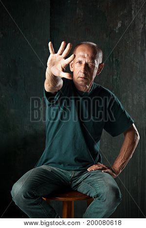 The mature screaming protester man at studio